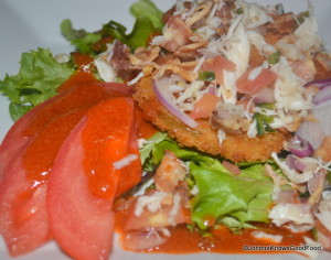 Aqua Fried Green Tomatoes BLT Salad topped with Local Crabmeat